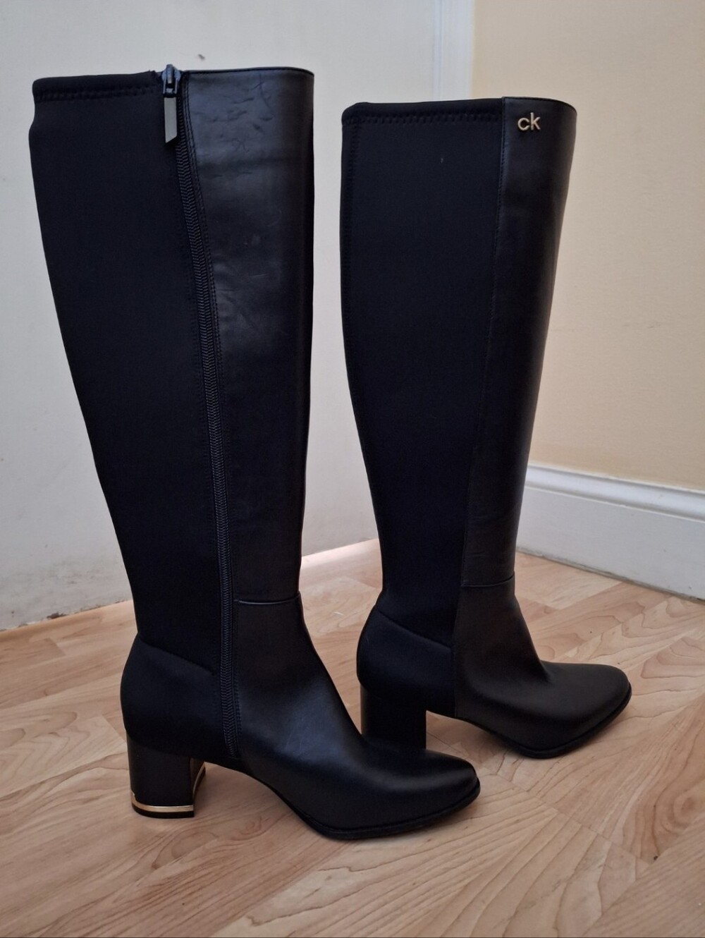 Calvin Klein Black Knee-High Block Heel Boots with Gold Accent
